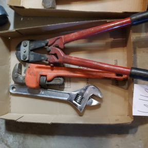 Bolt cutters, pipe wrench and adjustable wrench