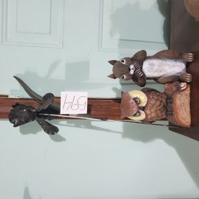 Concrete owl with molded squirrel and metal flower