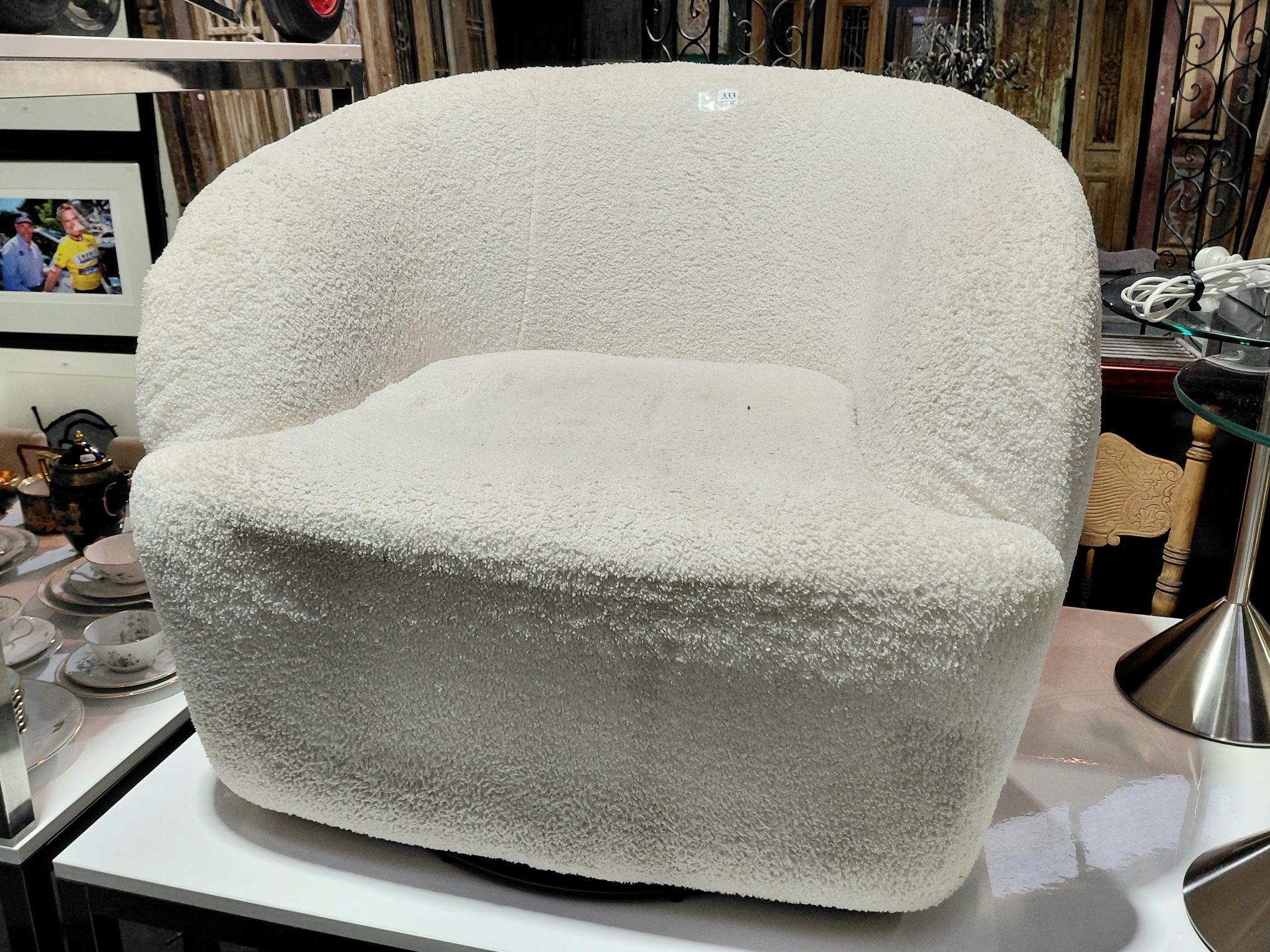 333 · A BOUCLE UPHOLSTERED ARMCHAIR