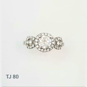 STERLING SILVER HALO RING WITH CUBICS TYING THE KNOT DESIGN