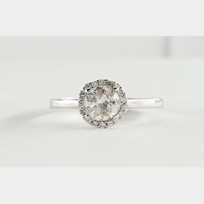 18CTWHITE GOLD HALO WITH 0.600CT COLOUR J CLARITY I CENTRE & 0.100CT SMALLS - 51929/3585