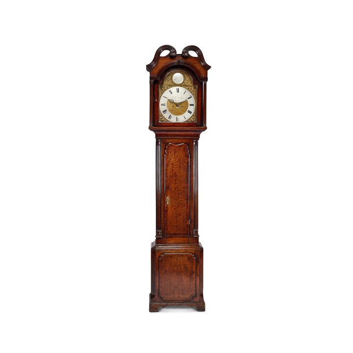 A George III oak and mahogany crossbanded longcase clock signed J. F. Wathew, Chester