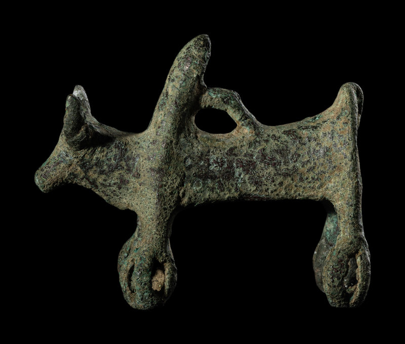 A Luristan Bronze Cow with Four Sphere Feet
Height 3 1/4 inches (8.26 cm).