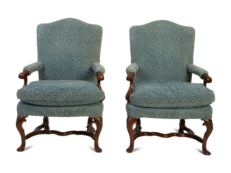 A Pair of Portuguese Carved Walnut  Armchairs
Height 41 1/2 x width 27 x depth 23 inches.