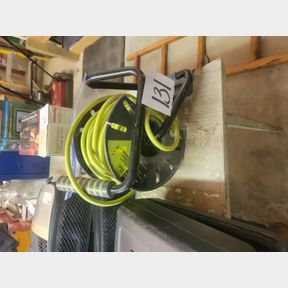 Electrical shop cord with reel and plastic clamps