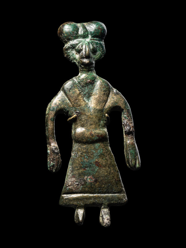 An Amlash Bronze Female Figure
Height 2 3/4 inches (7 cm).