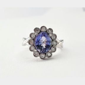 1.928CT TANZANITE AND .275CTS DIAMONDS COLOUR H/I CLARITY VS/SI IN 18CT WHITE GOLD RING - 6.4 GRAMS - 51624/121