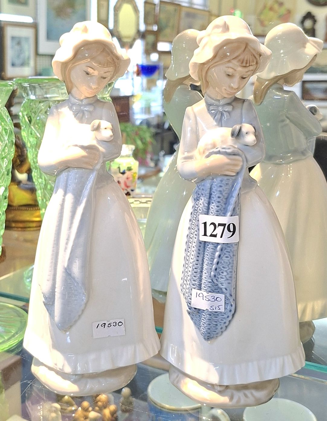 1279 · THREE NAO FIGURINES