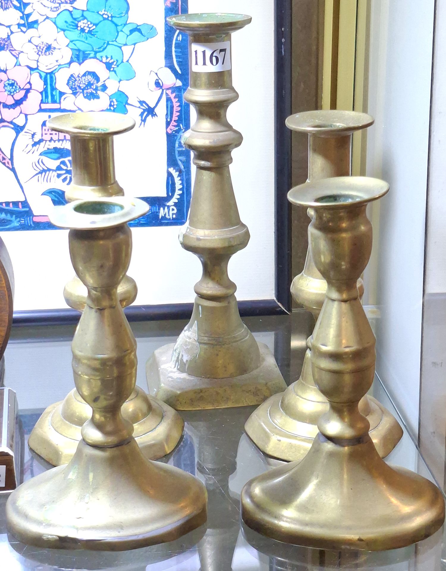 1167 · TWO PAIRS OF BRASS CANDLESTICKS