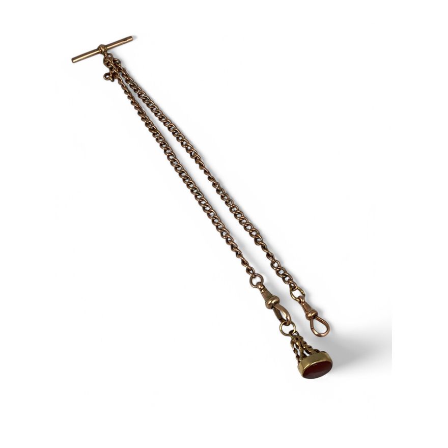 An Albert curblink chain with T-bar, fob clasps and oval cornelian seal type fob