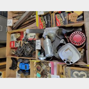 2 Boxes of small engine mufflers and repair parts