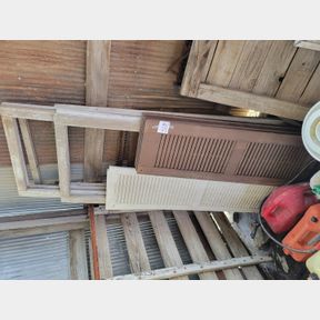 Plastic decorative shutters and wood window frames