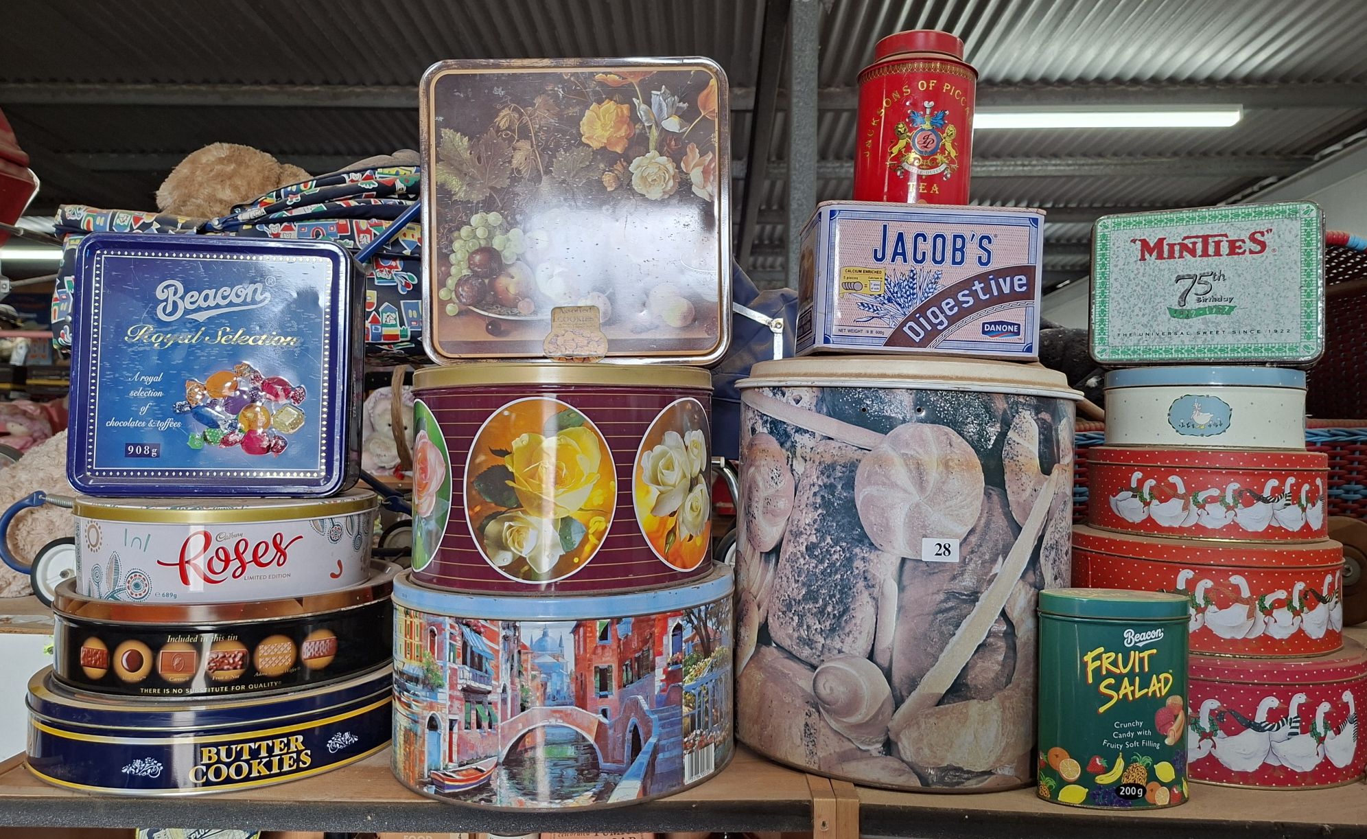 28 · ASSORTED TINS