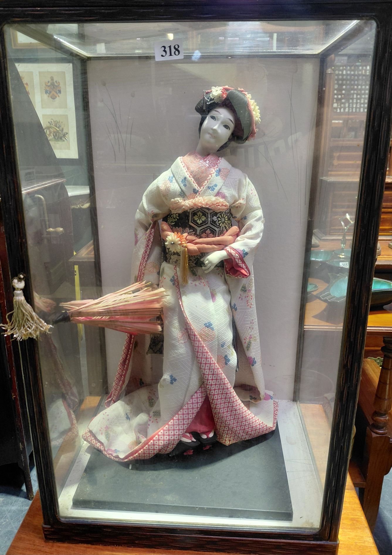 318 · GEISHA DOLL IN ANTIQUE WOODEN CASE