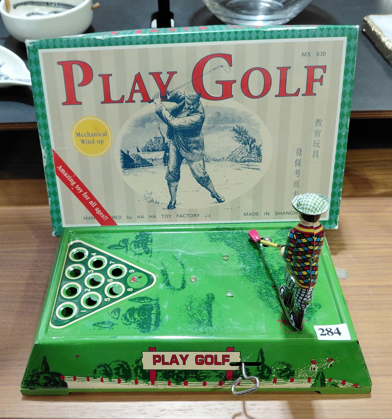 284 · VINTAGE TIN GOLF TOY