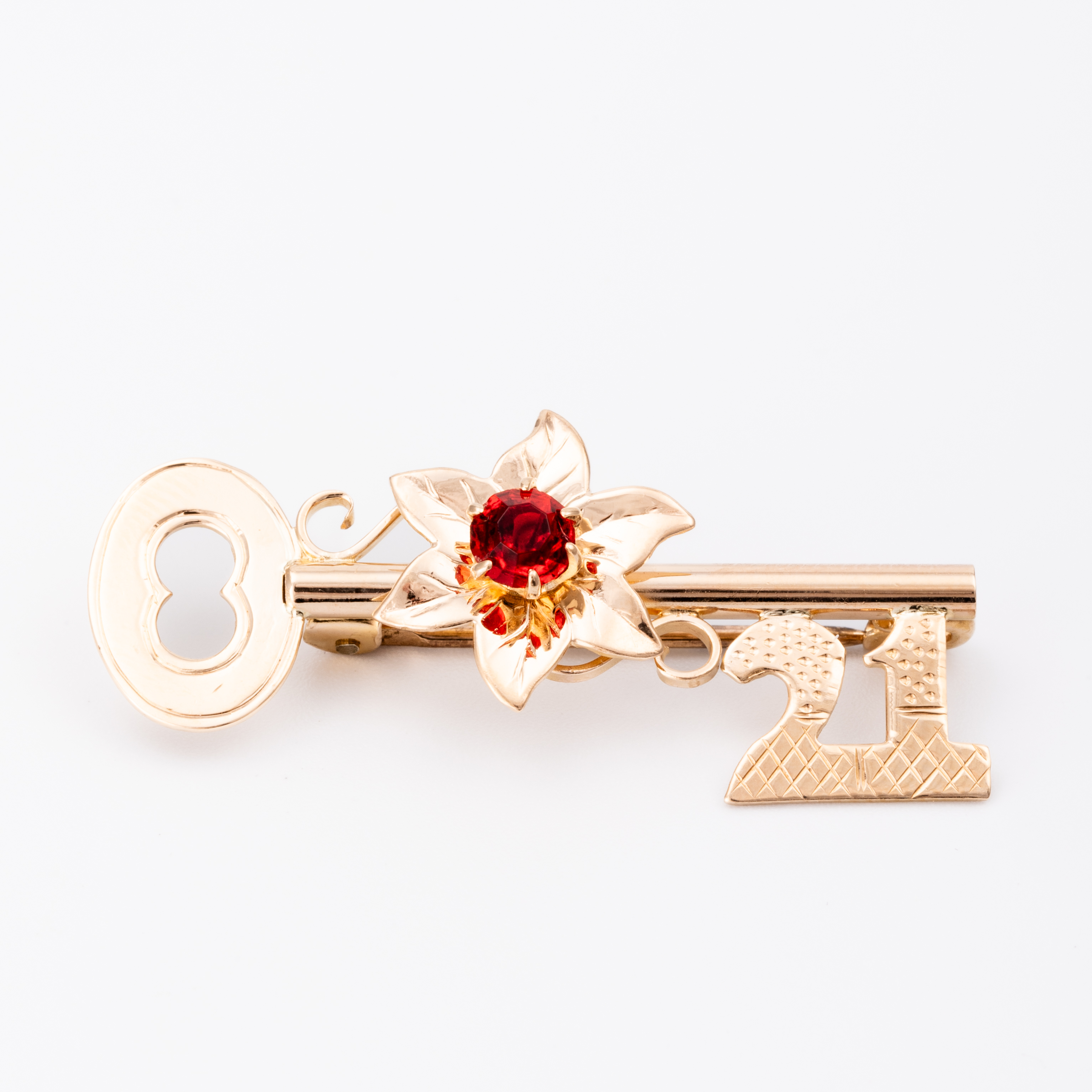 109 · 21st Key Flower Brooch 9ct Gold