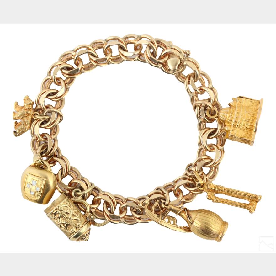 Sold at Auction: 14K YELLOW GOLD CHARM BRACELET W/ CHARMS, 73.7 GRAMS