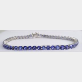 9.00CTS OF TANZANITES IN STUNNING WHITE GOLD TENNIS BRACELET - 51543/10