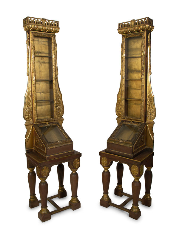 A Pair of Italian Giltwood Reliquary Cabinets
Height 82 x width 20 x depth 17 inches.