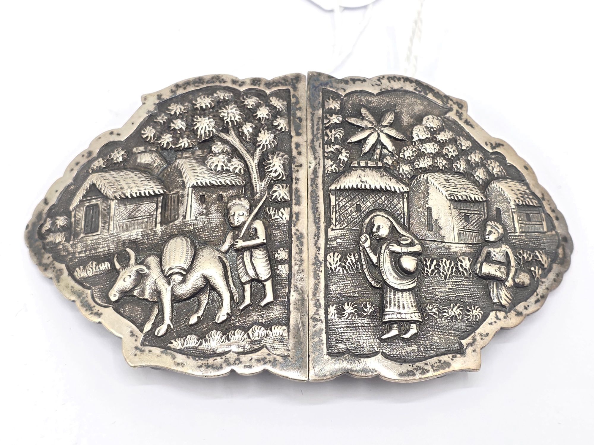 94 · SILVER EMBOSSED BELT BUCKLE