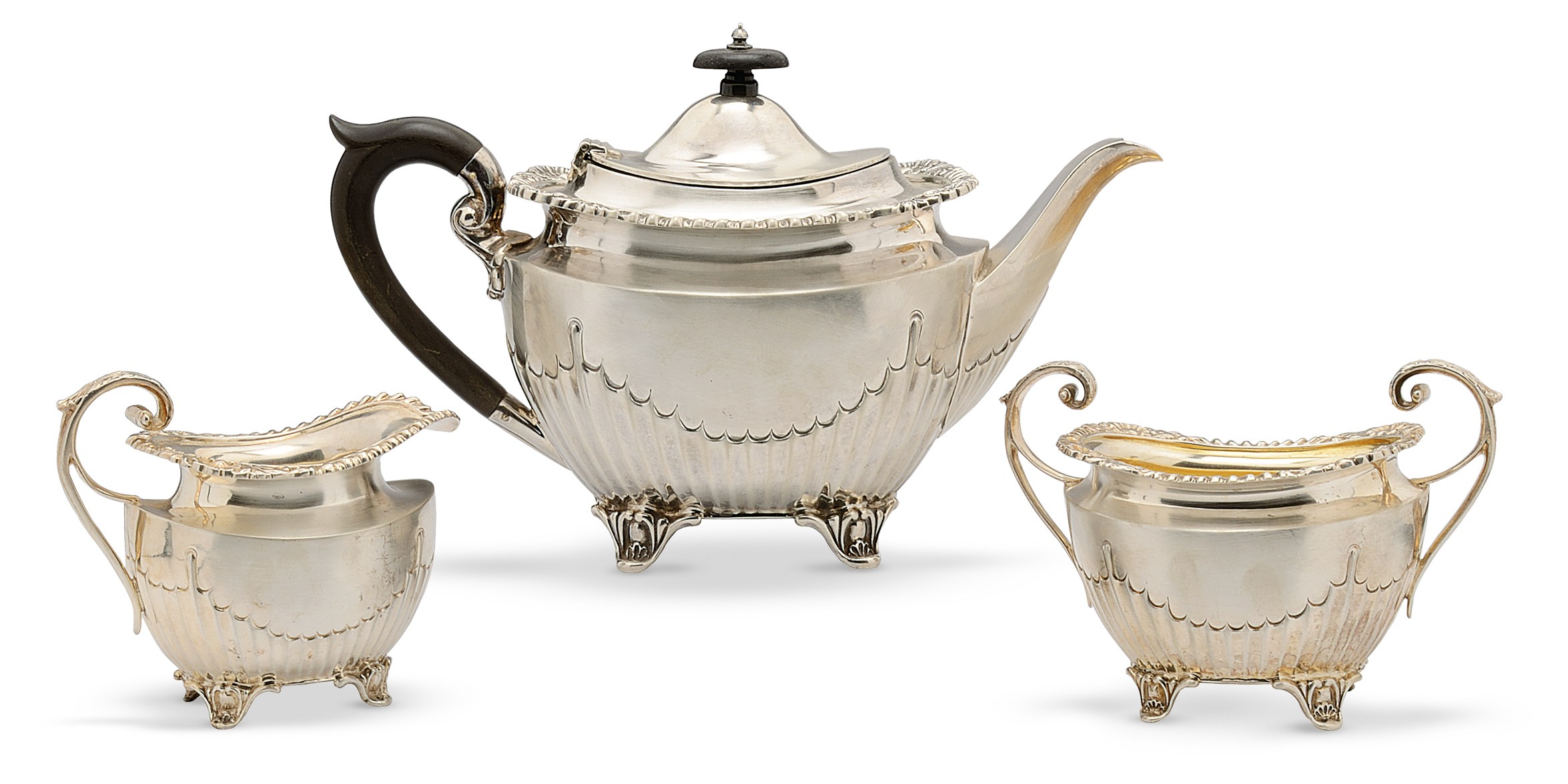 A late Victorian silver three piece tea set