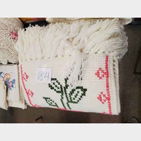 Crocheted bedspread with fancy work of flowers and roses