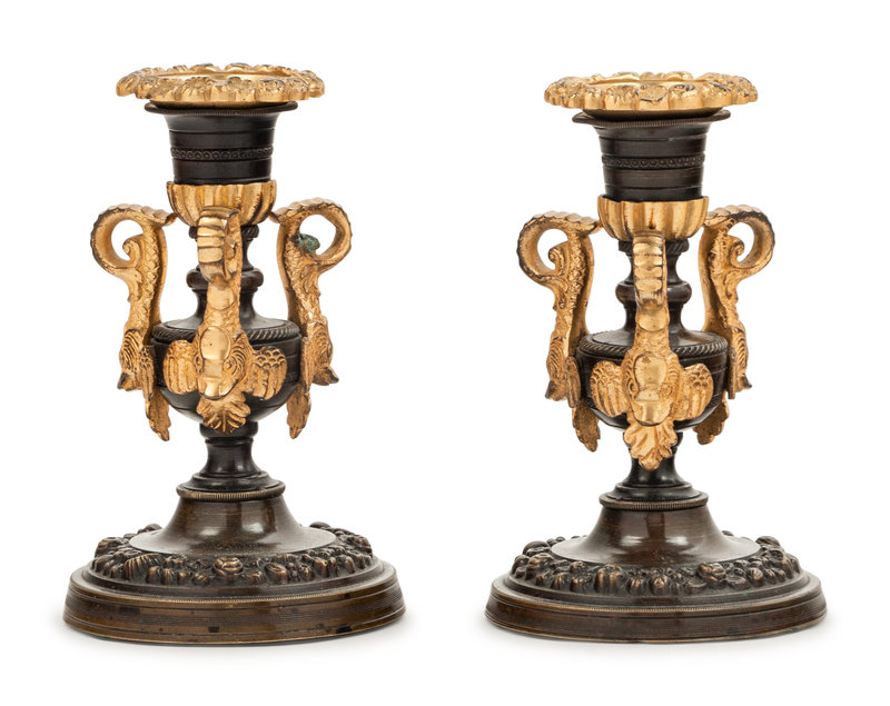 A Pair of Patinated and Gilt Bronze Candlesticks