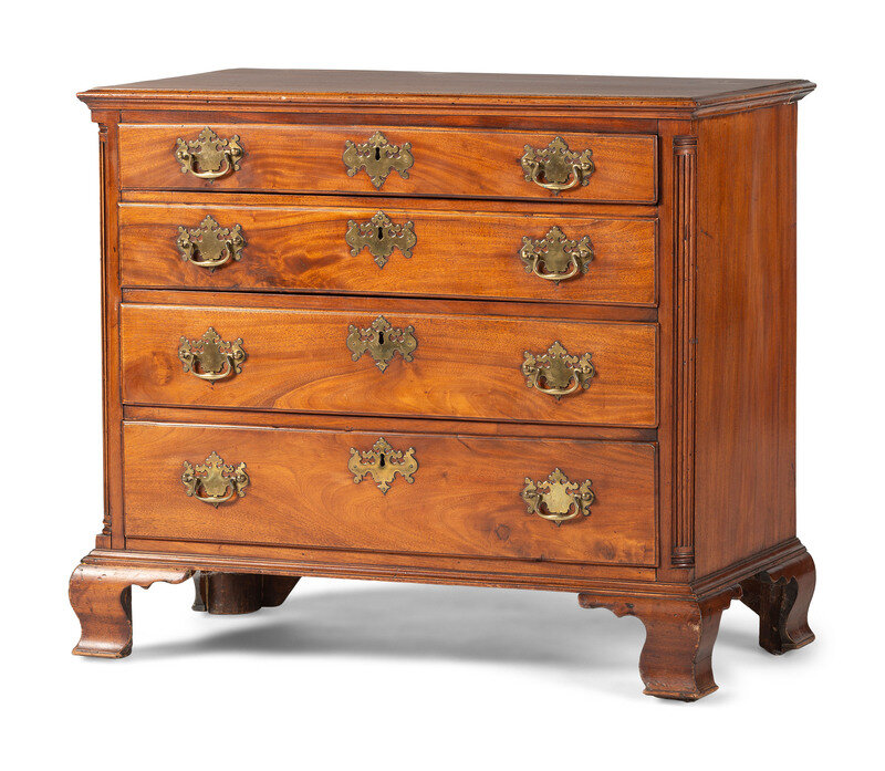 A Chippendale Carved and Figured Mahogany Chest of Drawers