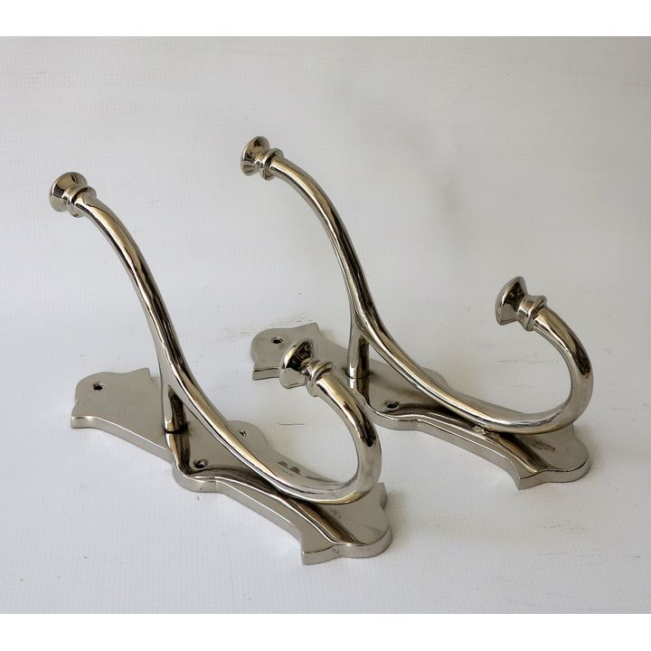 PAIR OF POLISHED METAL COAT HOOKS