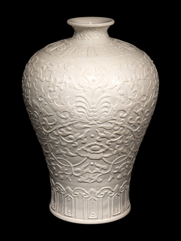 A Carved White Glazed Porcelain Meiping Vase
Height 11 3/4 in., 29.8 cm.