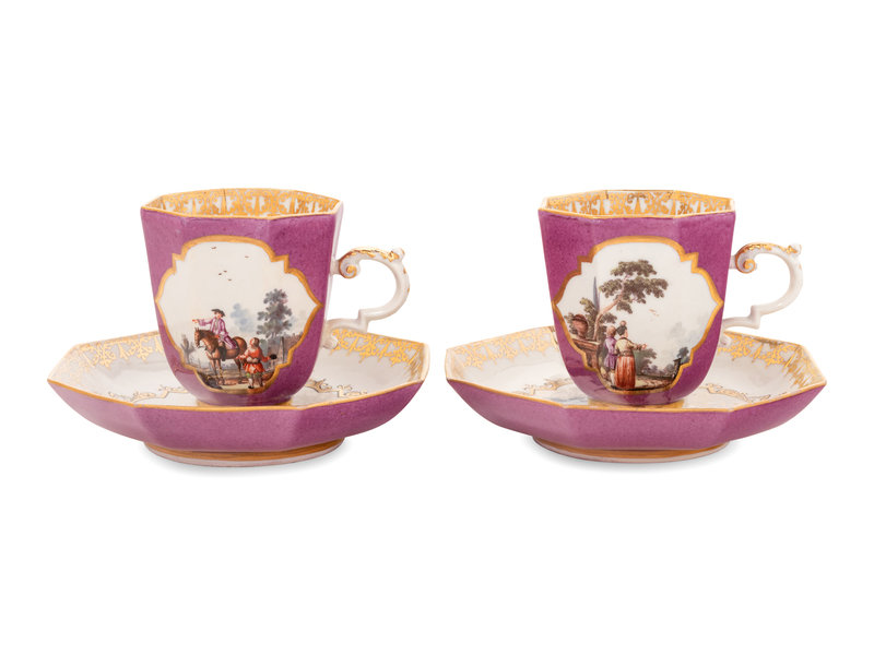 A Pair of Meissen Magenta-Ground Scenic Porcelain Teacups and Saucers 