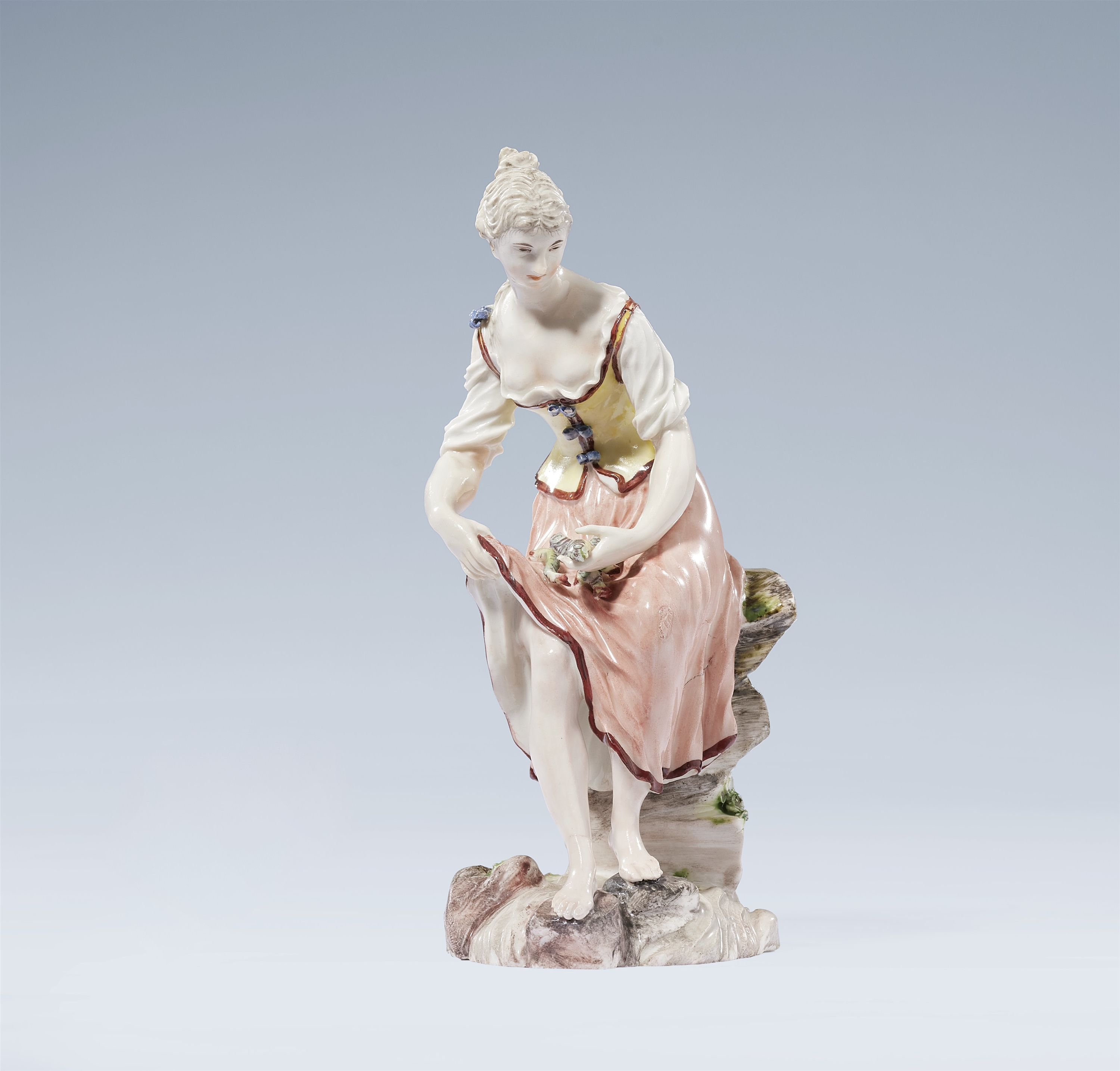 A Ludwigsburg porcelain figure of a fisherwoman by Johann Christian Friedrich Wilhelm Beyer
