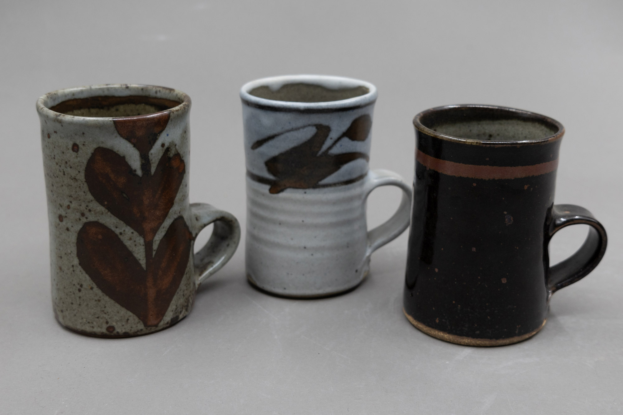 Warren Tippett - Three coffee mugs — sold at auction in New Zealand for $90