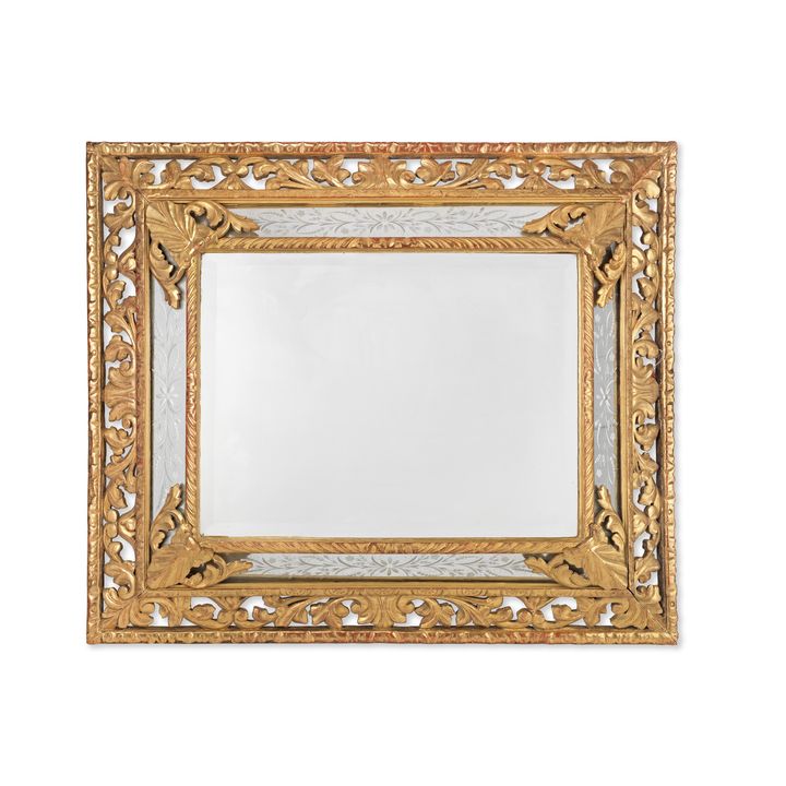 An early 20th century Venetian carved giltwood etched mirror