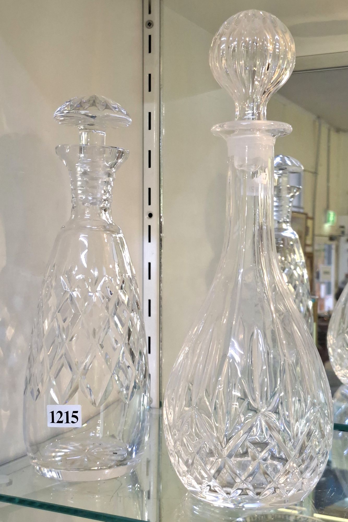 1215 · TWO TALL CRYSTAL DECANTERS