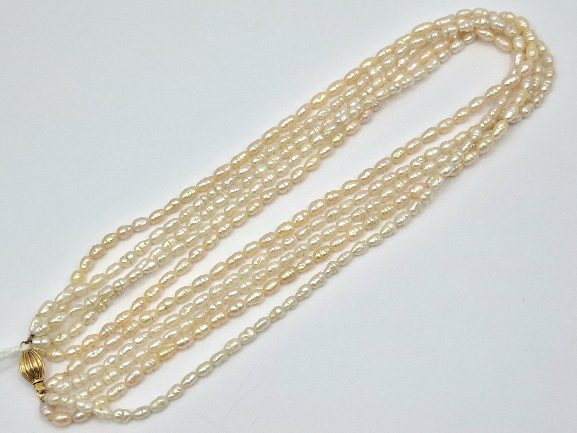 1162 · FIVE STRAND SEED PEARL NECKLACE
