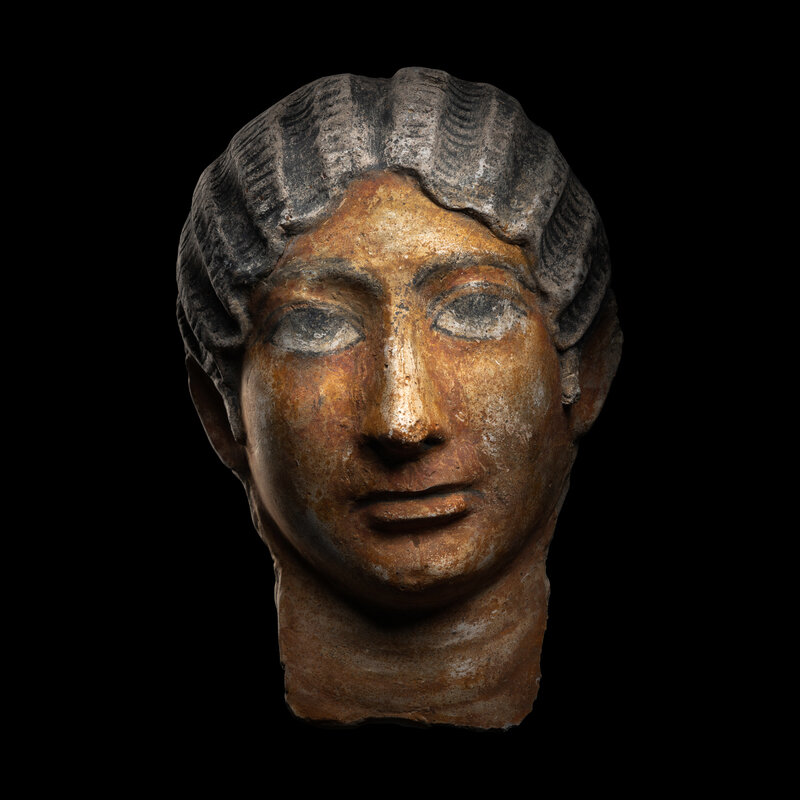A Romano-Egyptian Painted Stucco Portrait Head of a Woman