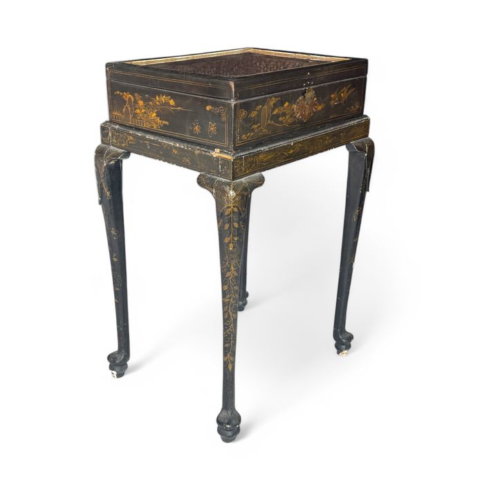 A small black Chinese-Export lacquered vitrine on japanned stand