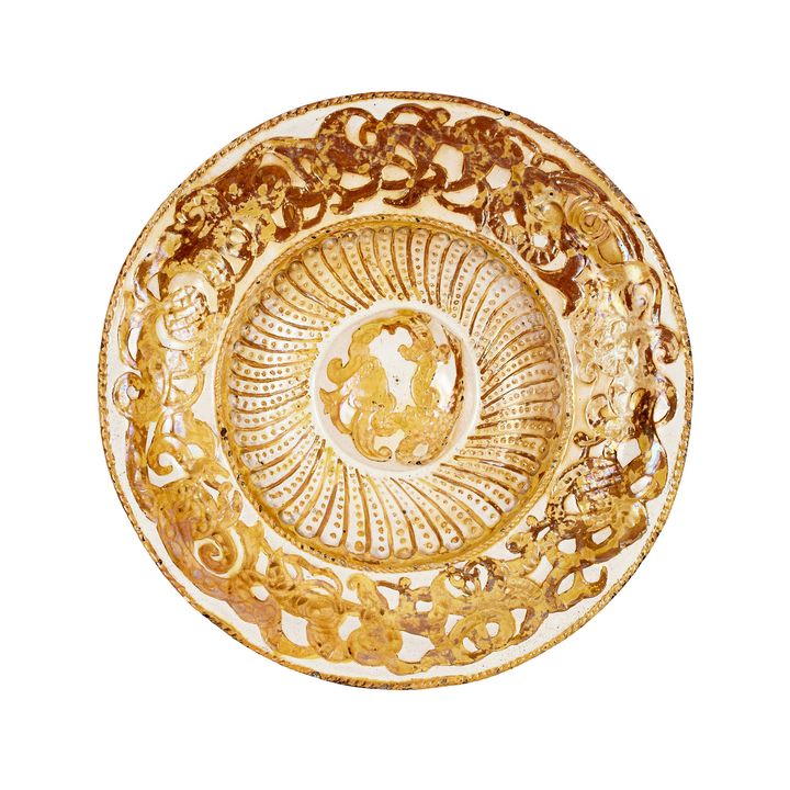 A white painted and parcel gilt charger, Iberian, 18th century