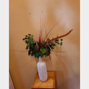 White Vase with Artificial Leafy Greens and Grass