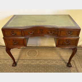 A HANDSOME MAHOGANY QUEEN ANNE STYLE WRITING DESK, with good green tooled leather top with a curved concave ce