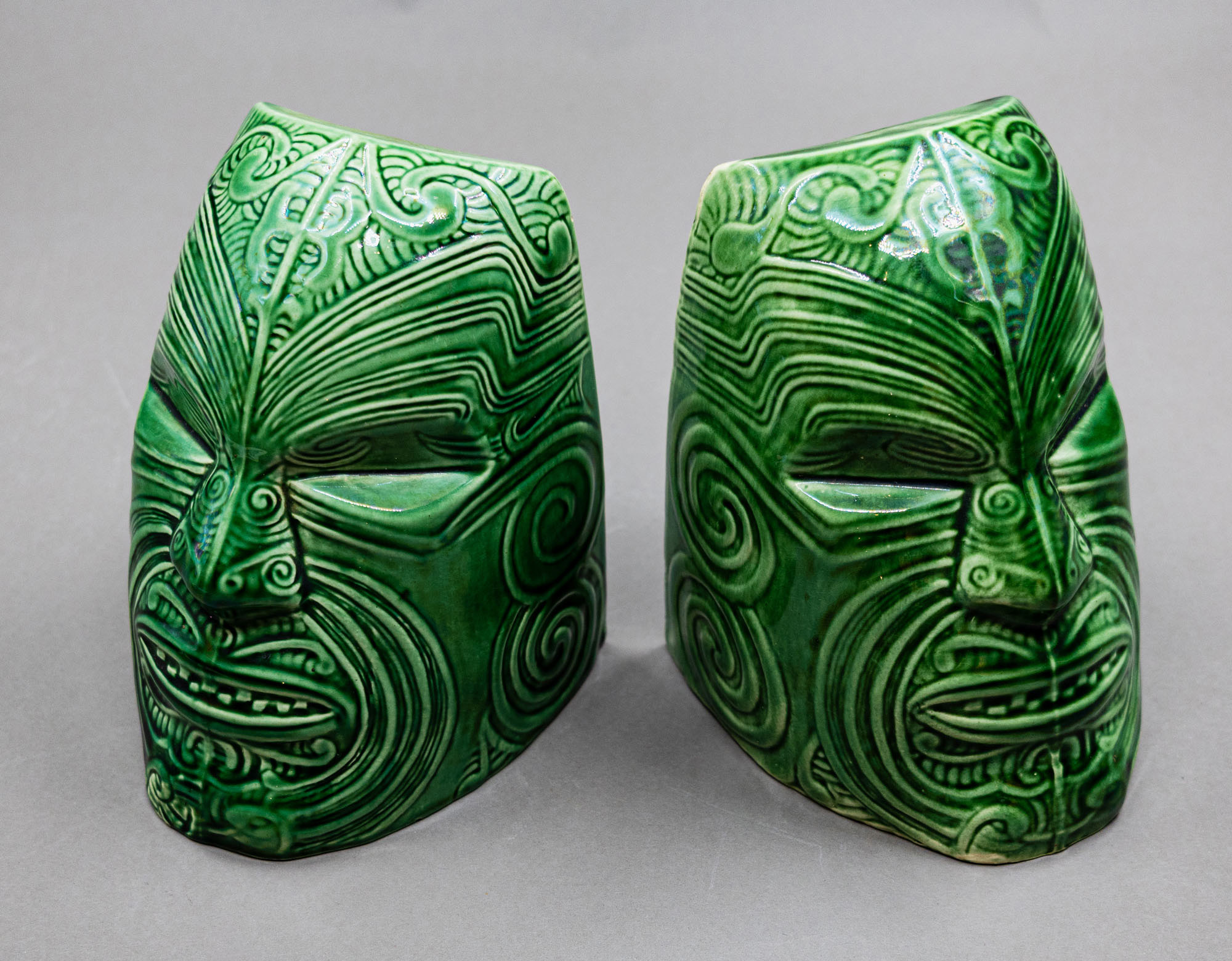 Crown Lynn Wharetana Ware - Pair of 'Moko' bookends — sold at auction in New Zealand for $3,000
