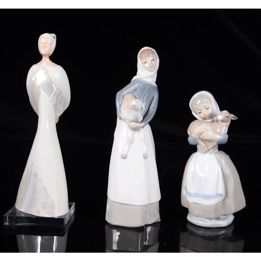 Three Spanish figurines comprising Nao 'Girl with Lamb', Lladro