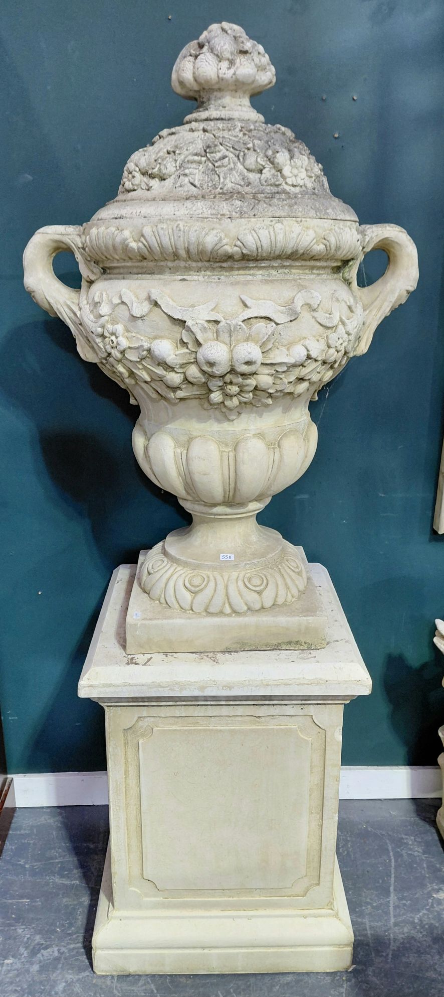 A MONUMENTAL PAIR OF URNS