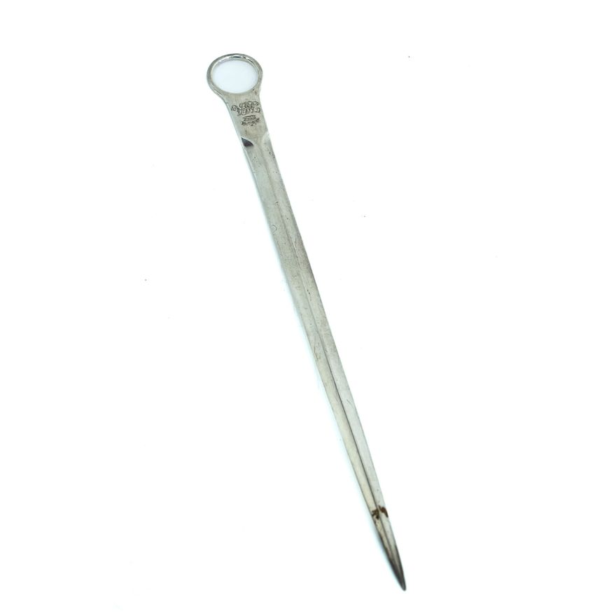 A silver meat skewer