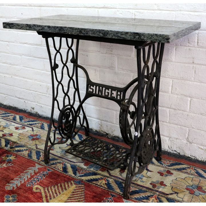 SINGER CAST IRON AND GRANITE SIDE TABLE,
