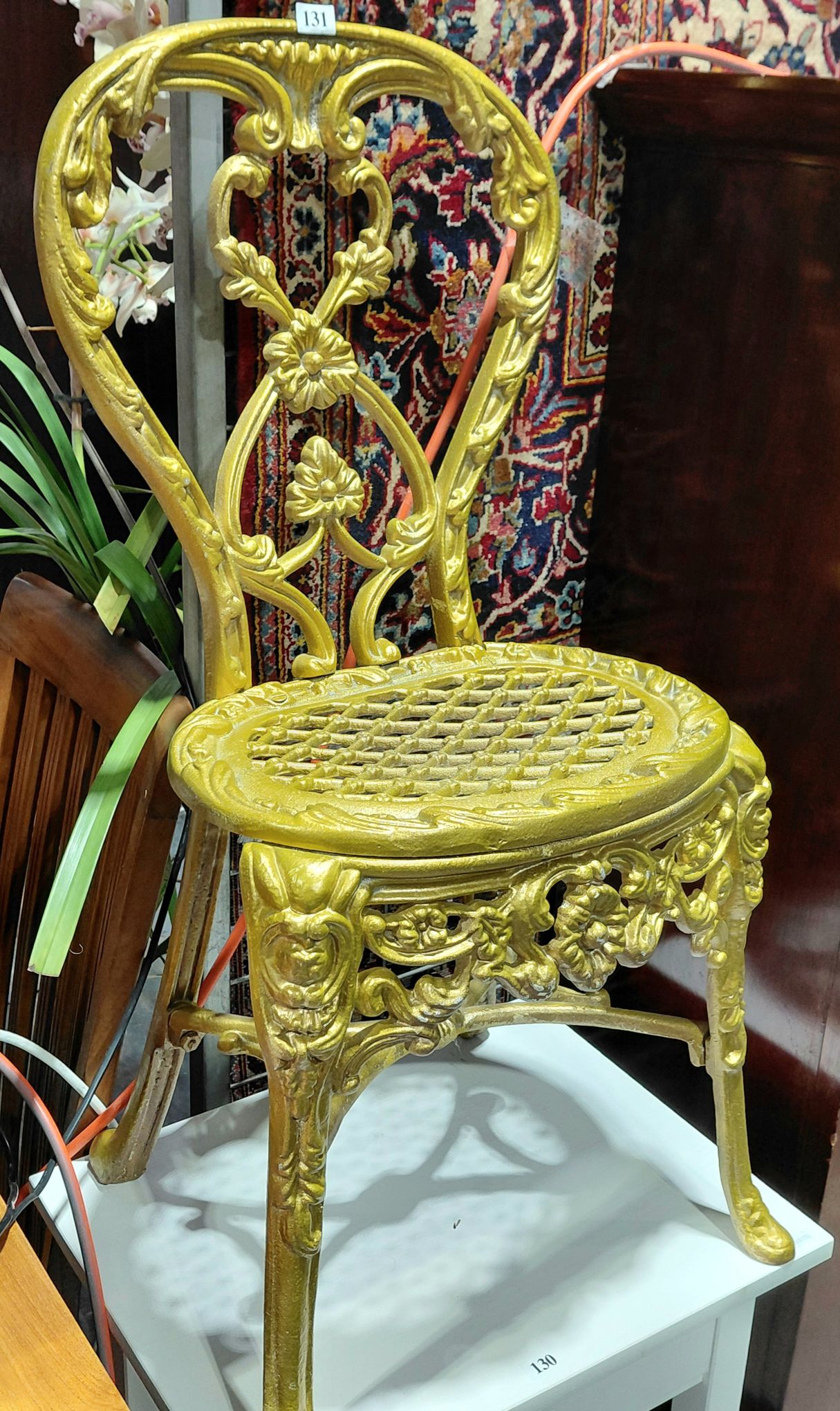131 · A PAIR OF CAST IRON CHAIRS