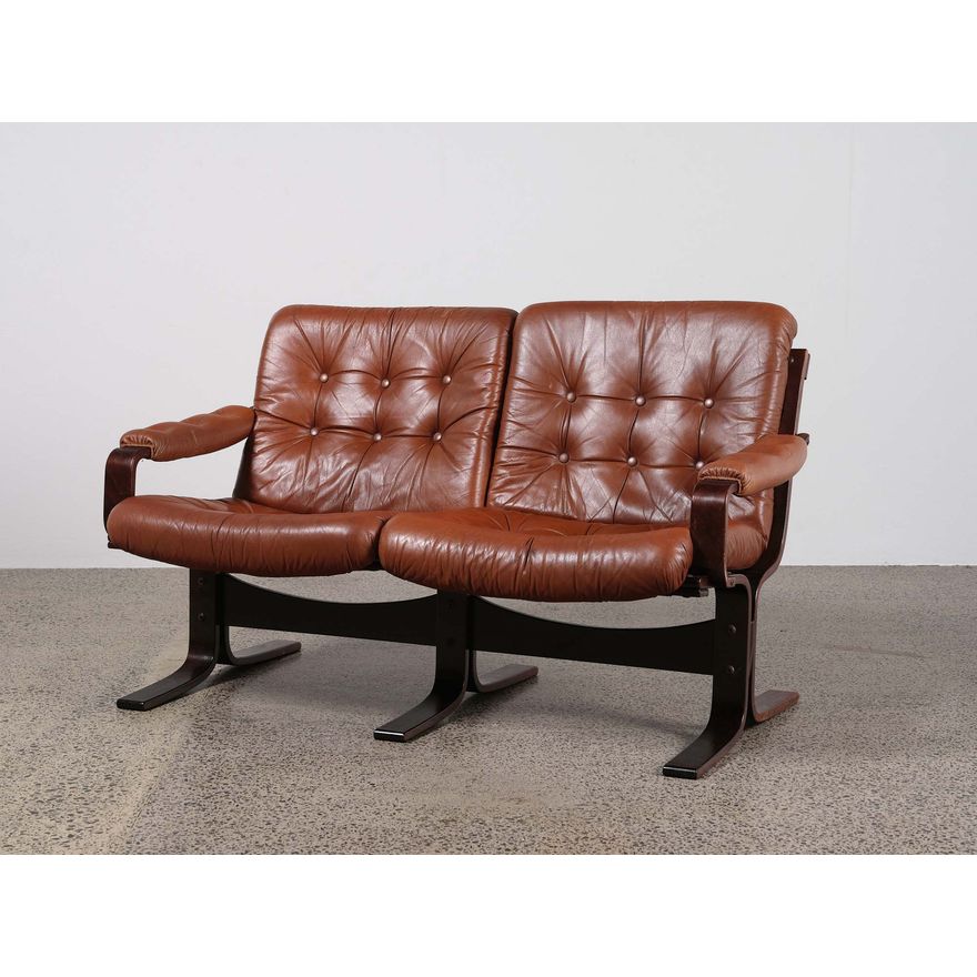A two-seater Scandinavian 1960s leather sofa