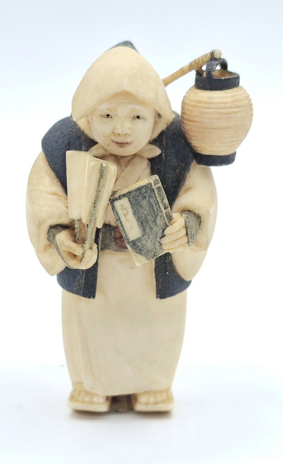 20 · JAPANESE CARVED IVORY NETSUKE