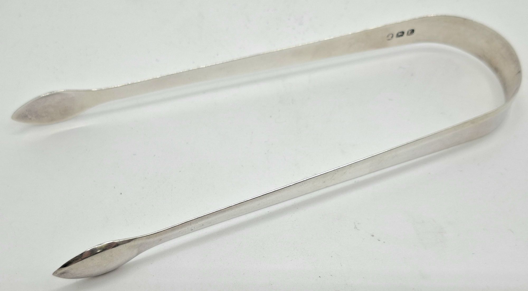 147 · GEORGIAN STERLING SILVER TONGS